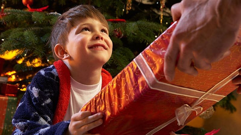 joyful Child receiving a christmas gift